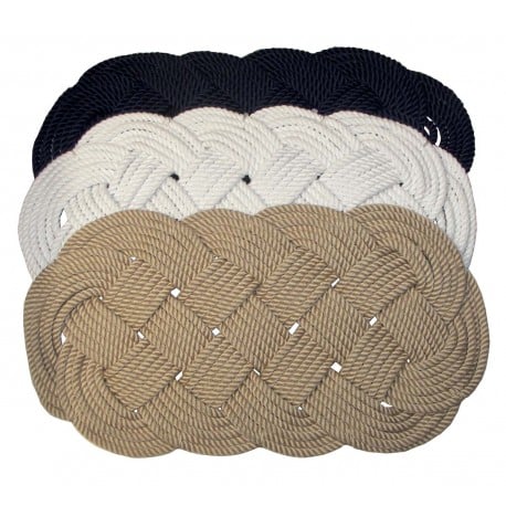 Oval hand-woven rug in solid colour